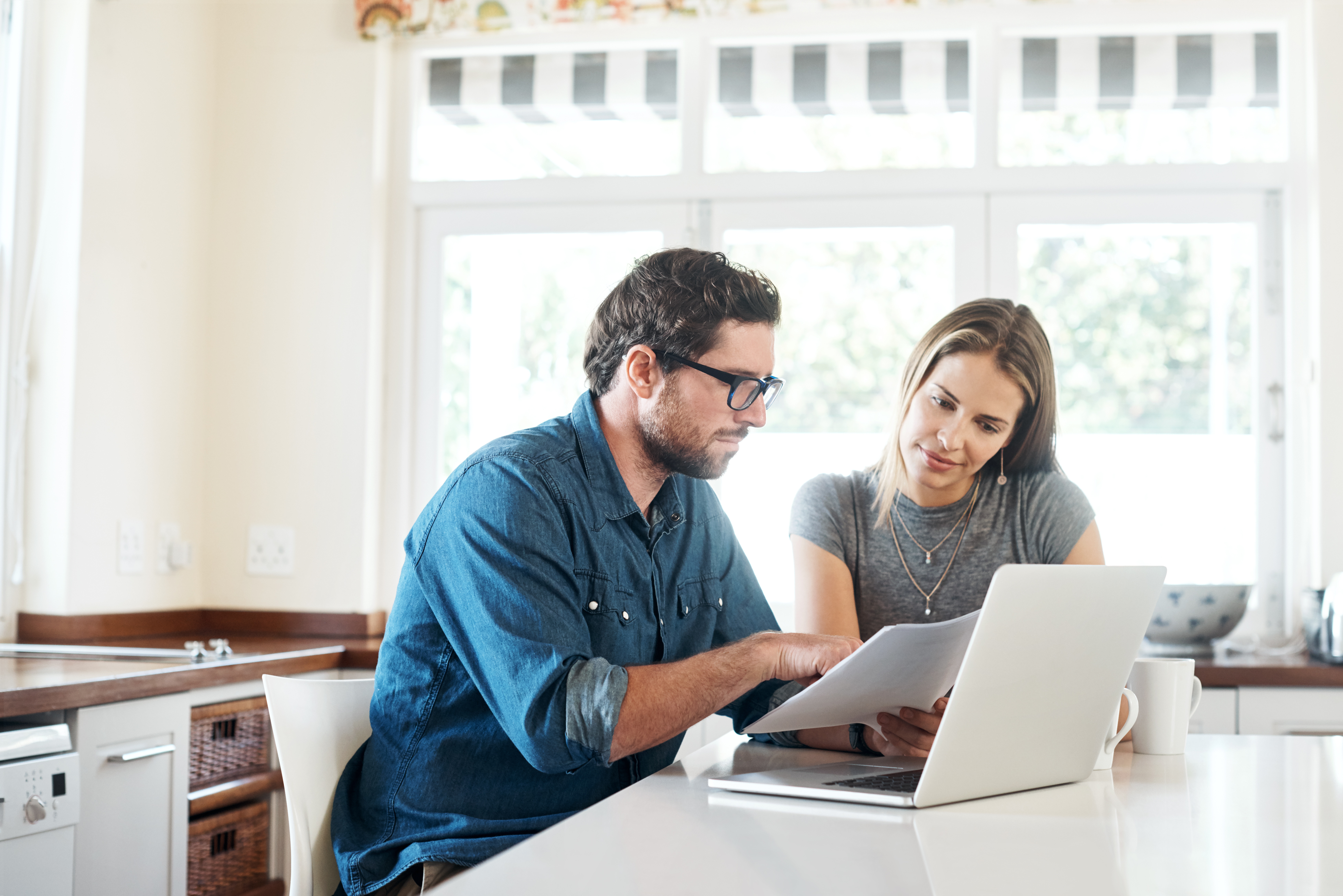Two people discussing documents
